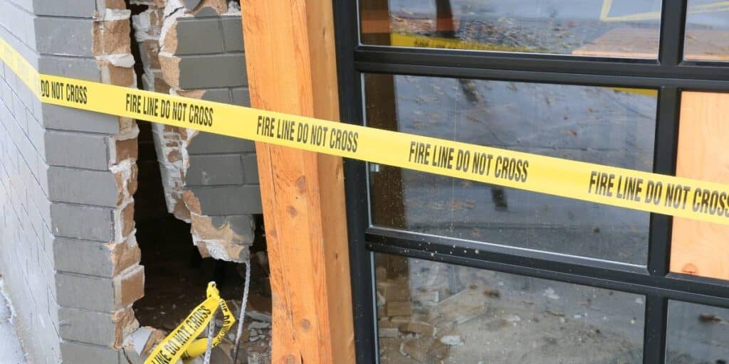 Fire line do not cross tape across a building with property damage.